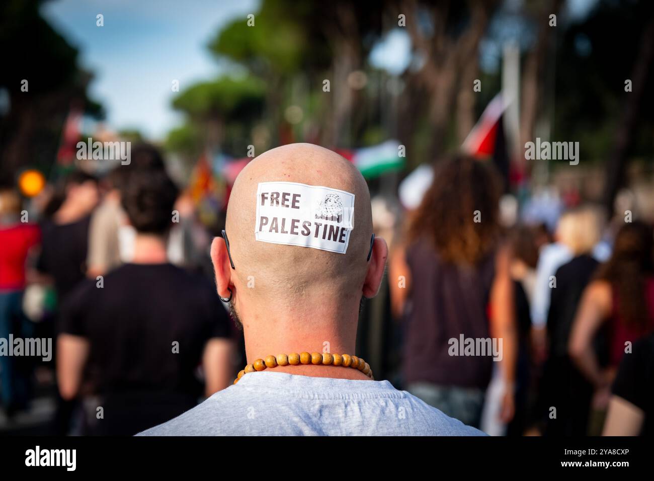 Rome, Italy. 12th Oct, 2024. Free Palestine sticker on bald head. Thousands join the march on the streets of Rome to support Palestine and Lebanon, demanding 'Stop bombing' and 'Free Palestine' (Credit Image: © Marco Di Gianvito/ZUMA Press Wire) EDITORIAL USAGE ONLY! Not for Commercial USAGE! Stock Photo