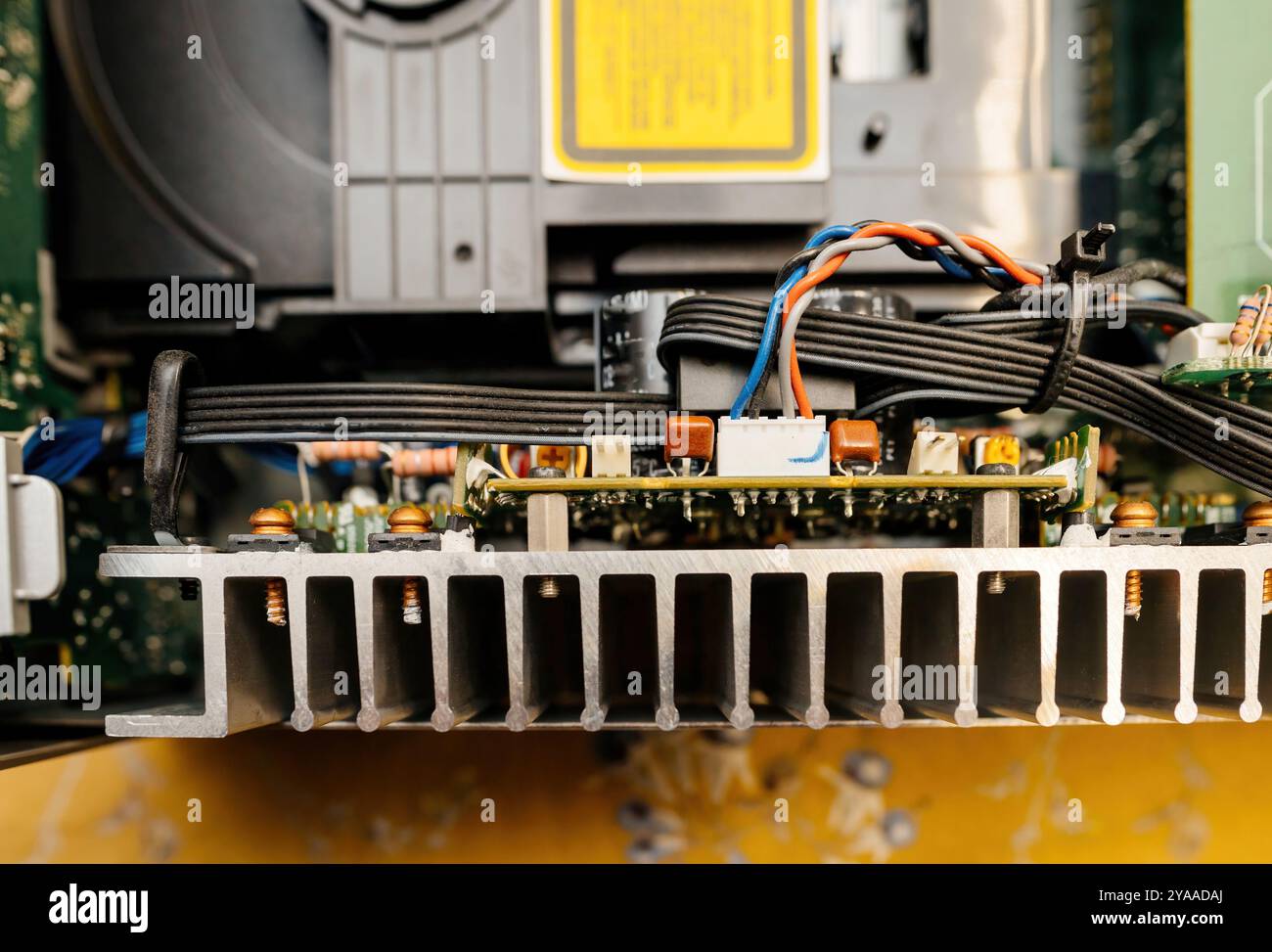 Close-up of a heat sink and wiring inside an electronic device ...