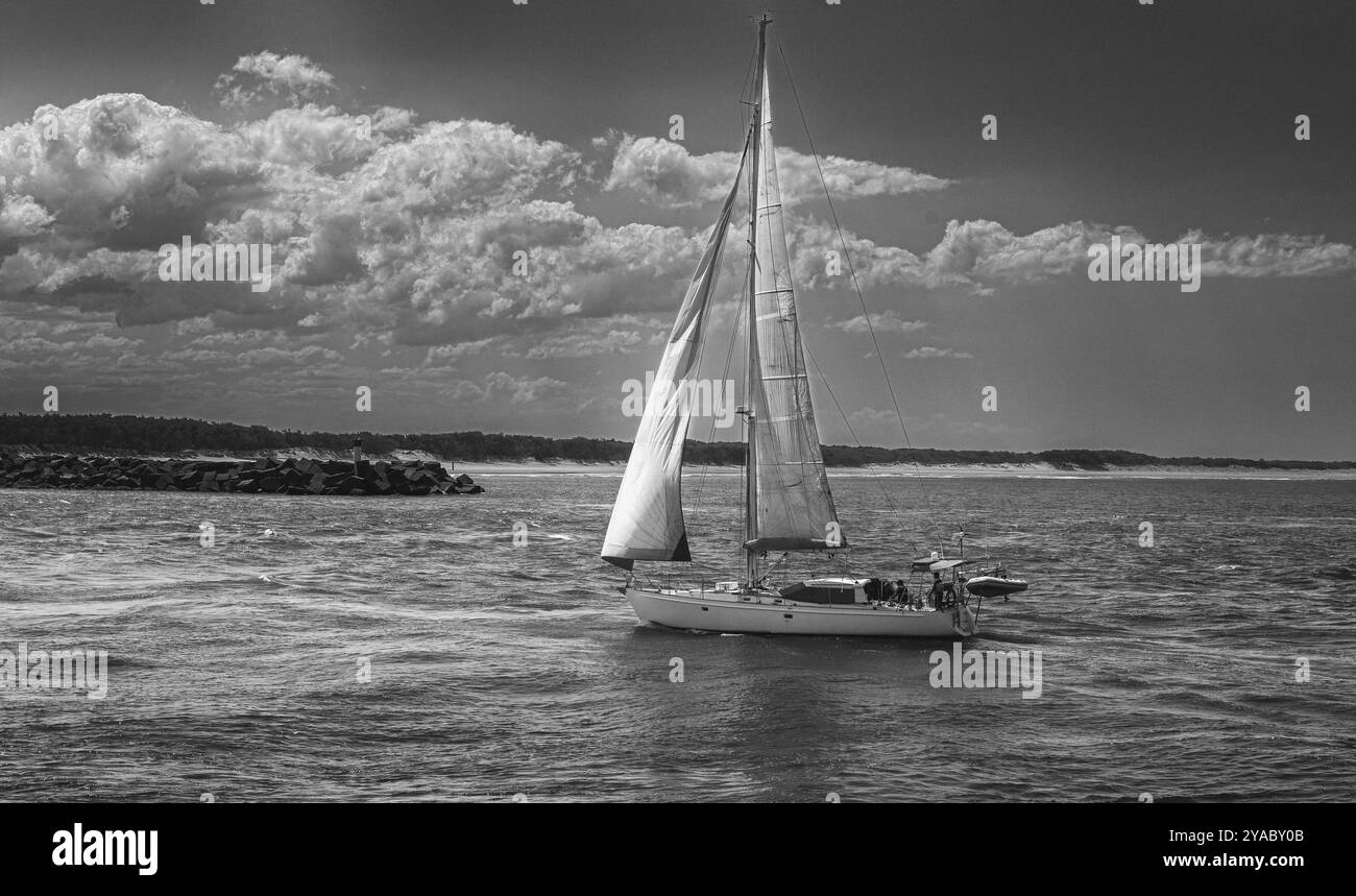 Boat entering harbour in Black and White Stock Photos & Images - Alamy