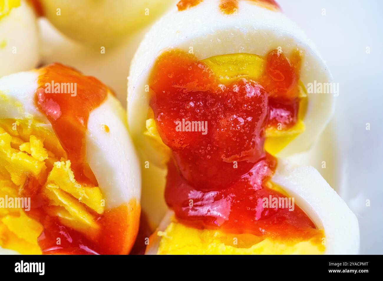 Boiled egg with ketchup and salt. Stock Photo