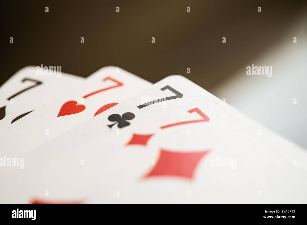 Four cards featuring the number seven, emphasizing themes of luck, gambling, and fortune. Ideal for casino promotions, gaming websites, or lucky numbe Stock Photo