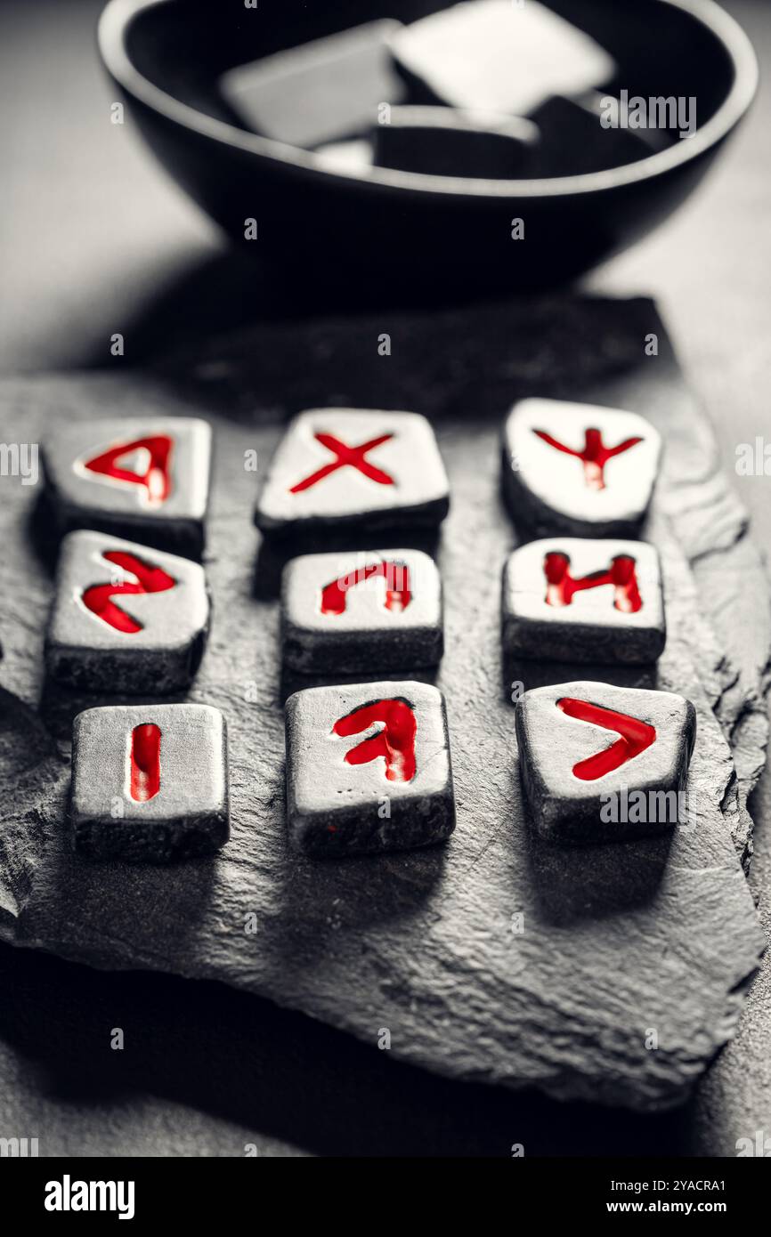 Closeup of unique rune stones based on antique language as mystical ...