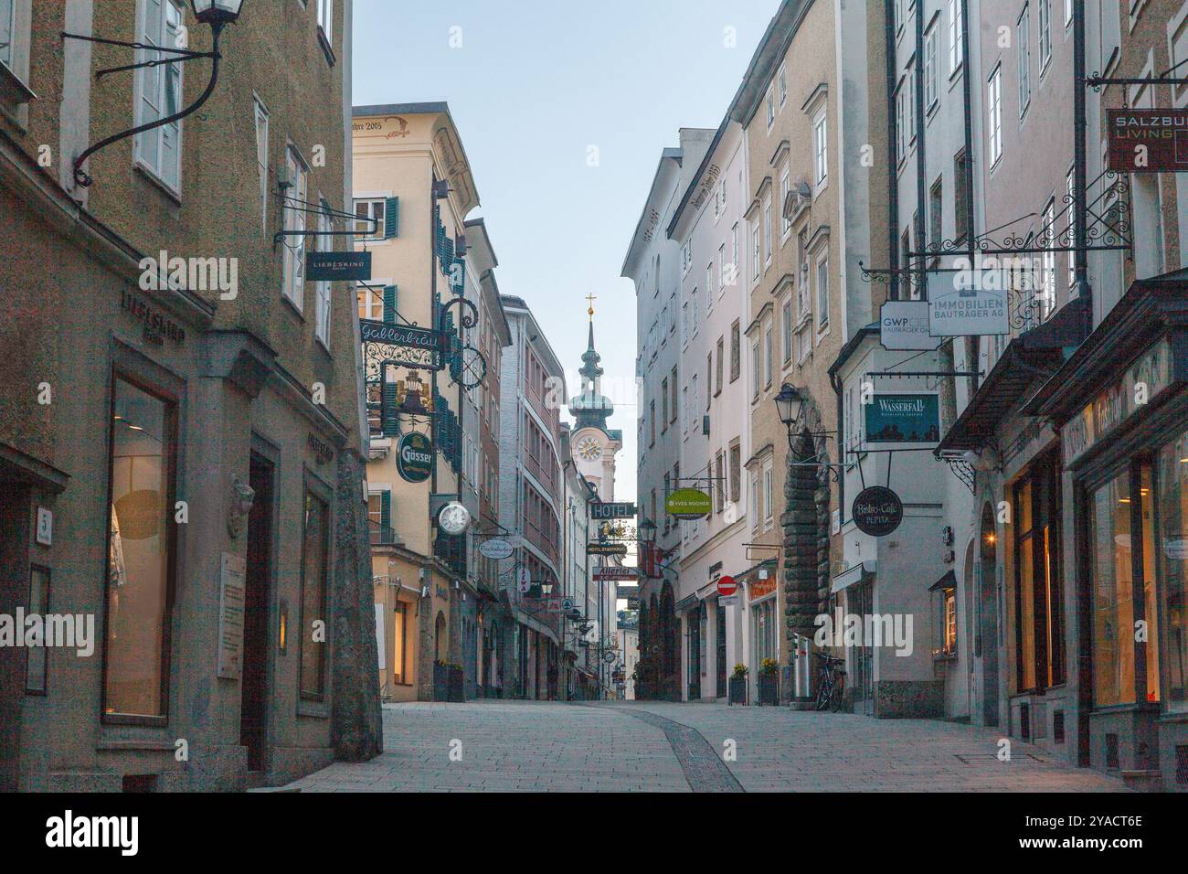 Typical historical street in downtown Salzburg and iconic ...