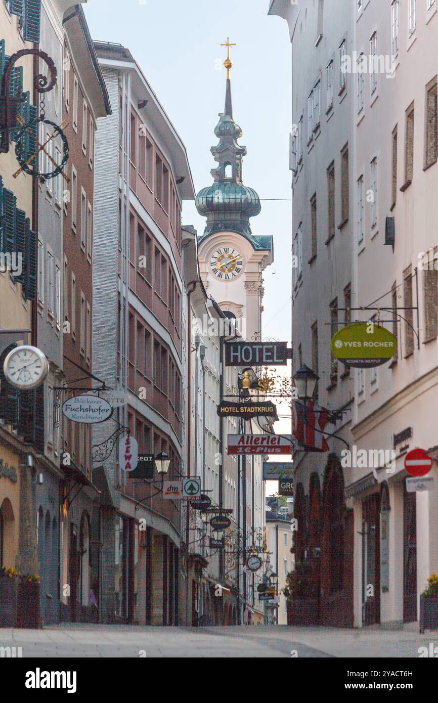 Typical historical street in downtown Salzburg and iconic ...