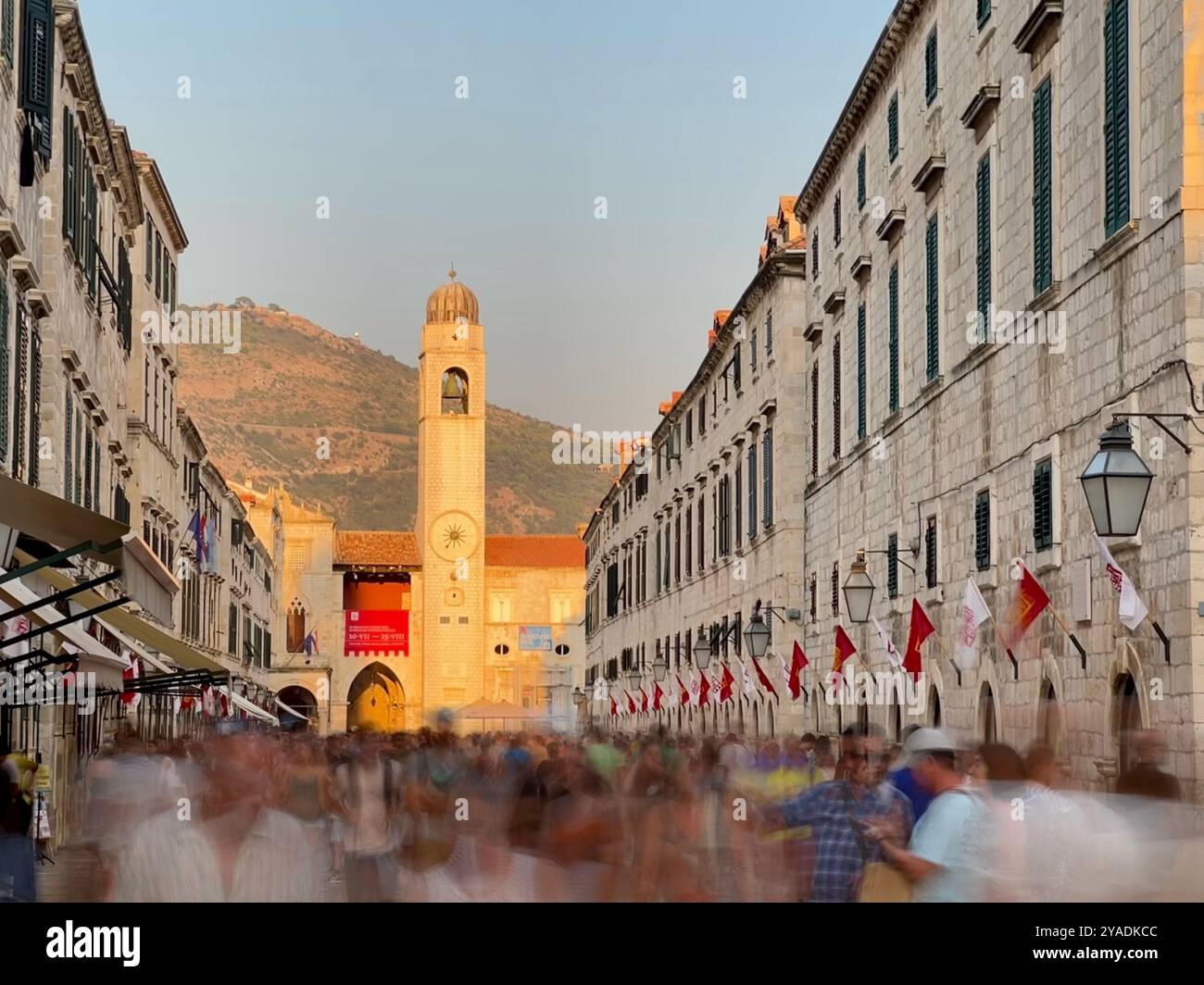 Stradun (Placa) in Dubrovnik old town. Looking down street towards bell tower in evening light. Dubrovnik, Croatia - Smartphone Captured Stock Image Stradun (Placa) in Dubrovnik old town. Looking down street towards bell tower in evening light. Dubrovnik, Croatia - Smartphone Captured Stock Image
