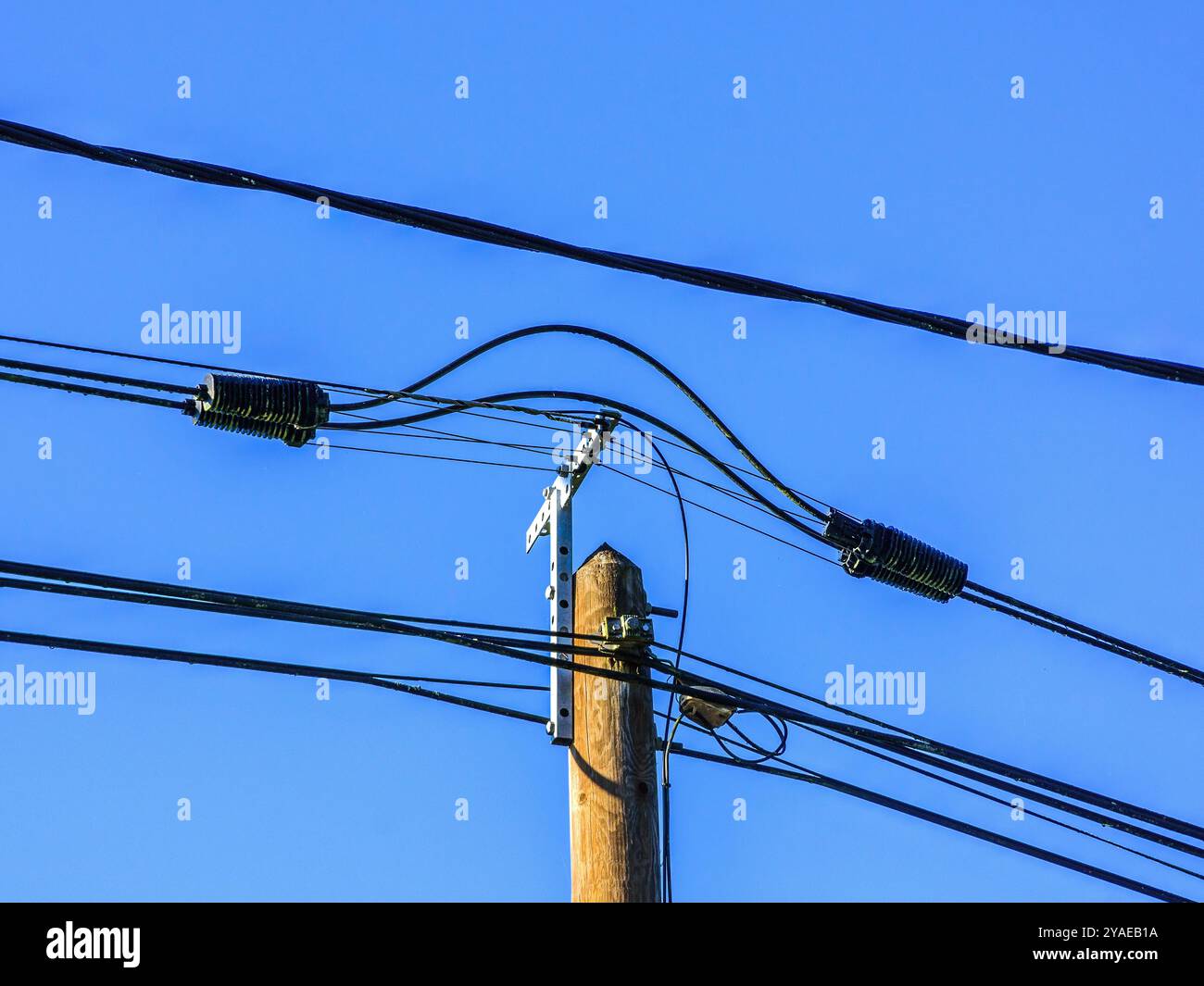 New telegraph post with telephone and fiber optic cables for hi-speed internet - Preuilly-sur-Claise, Indre-et-Loire (37), France. Stock Photo