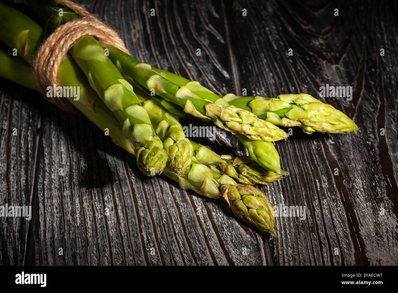 asparagus on black wood background Stock Photo