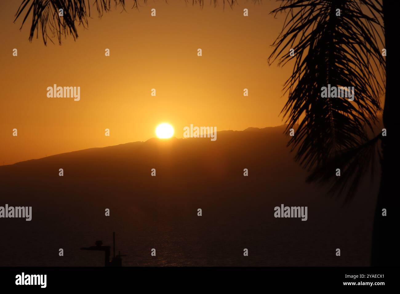 Sun going down over the mountain Stock Photo