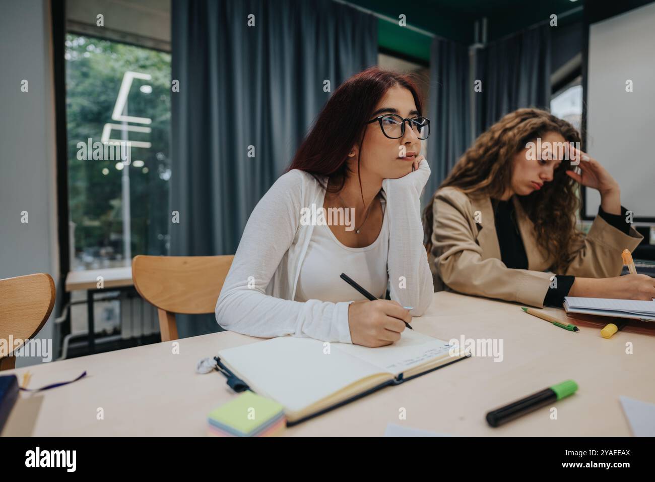 Taking notes during a lecture hi-res stock photography and images - Alamy