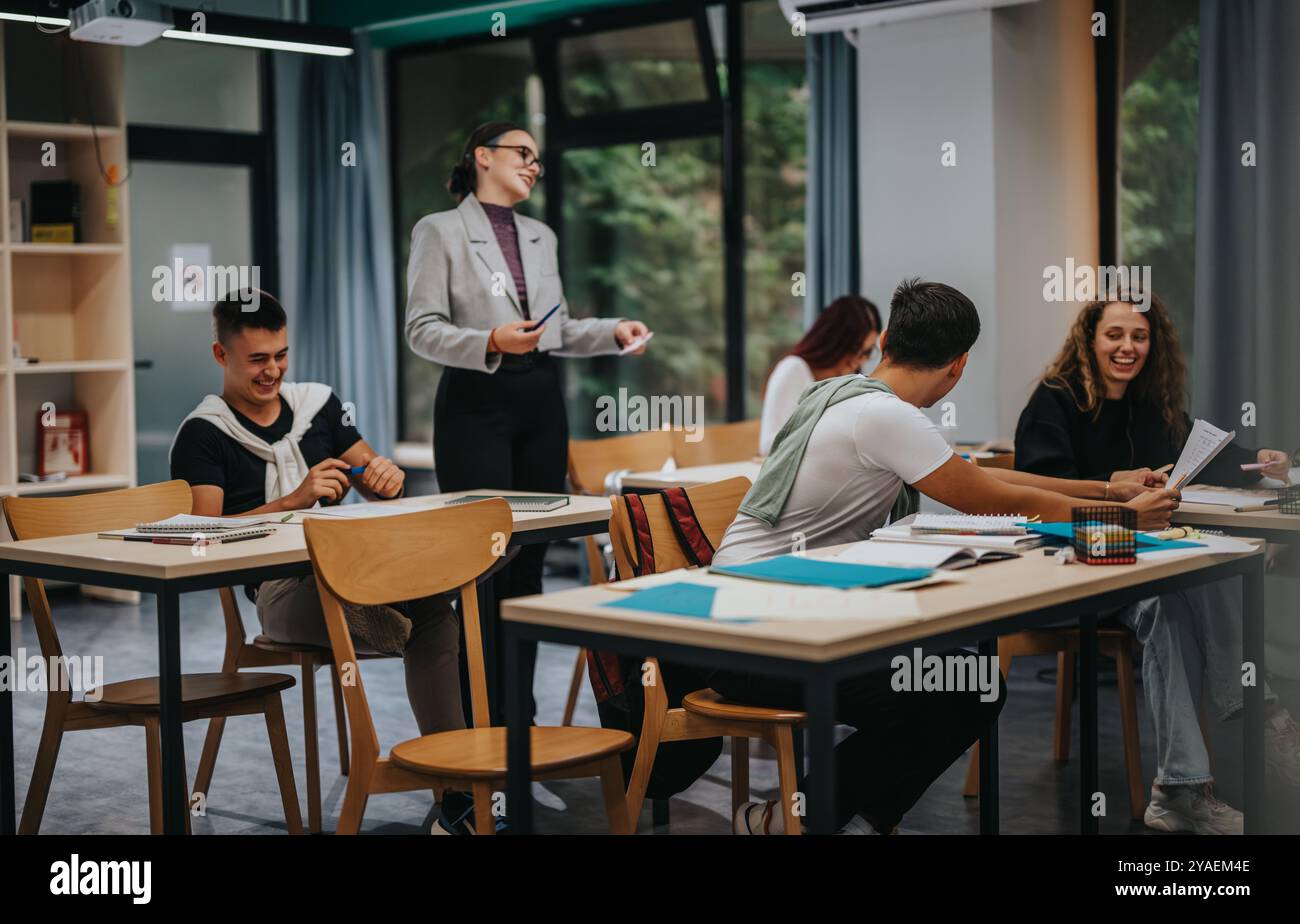 Engaged students interacting during a lively classroom session Stock Photo