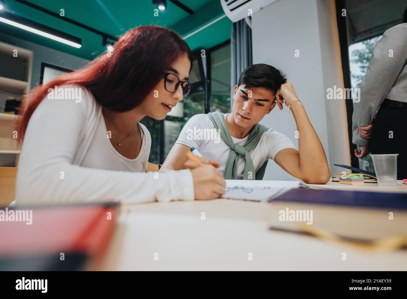 Focused students collaborating on creative classroom project Stock Photo