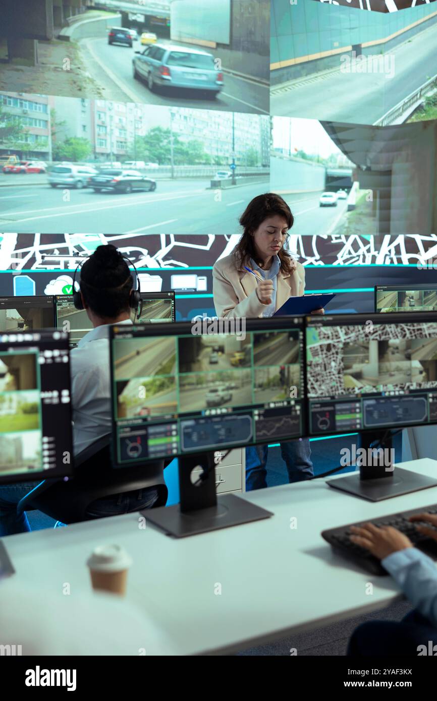 Team leader overseeing diverse operators in delivery call center office ...