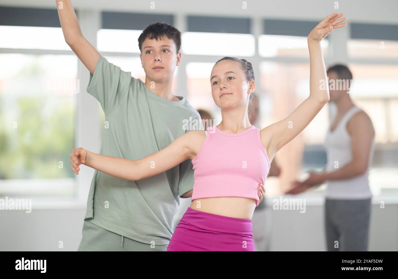 Boy And Girl In Pair Train To Perform Ballet Dance During Rehearsal In boy-and-girl-in-pair-train-to-perform-ballet-dance-during-rehearsal-in