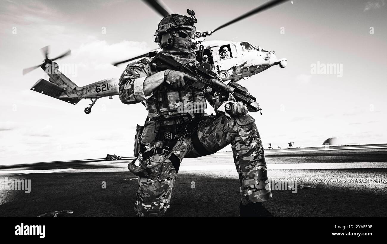 Seahawk Fast Roping A Sailor assigned to Explosive Ordnance Disposal Mobile Unit (EODMU) 5 ...