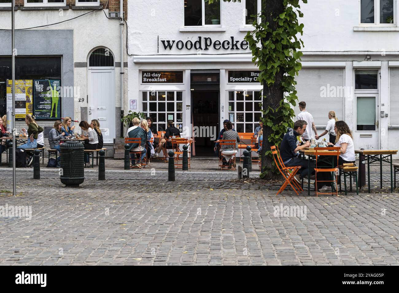 Brussels Old Town, Brussels Capital Region, Belgium, 06 26 2022, People sitting at a terrace of the Woodpecker restaurant at Place Sainte Catherine, E Stock Photo