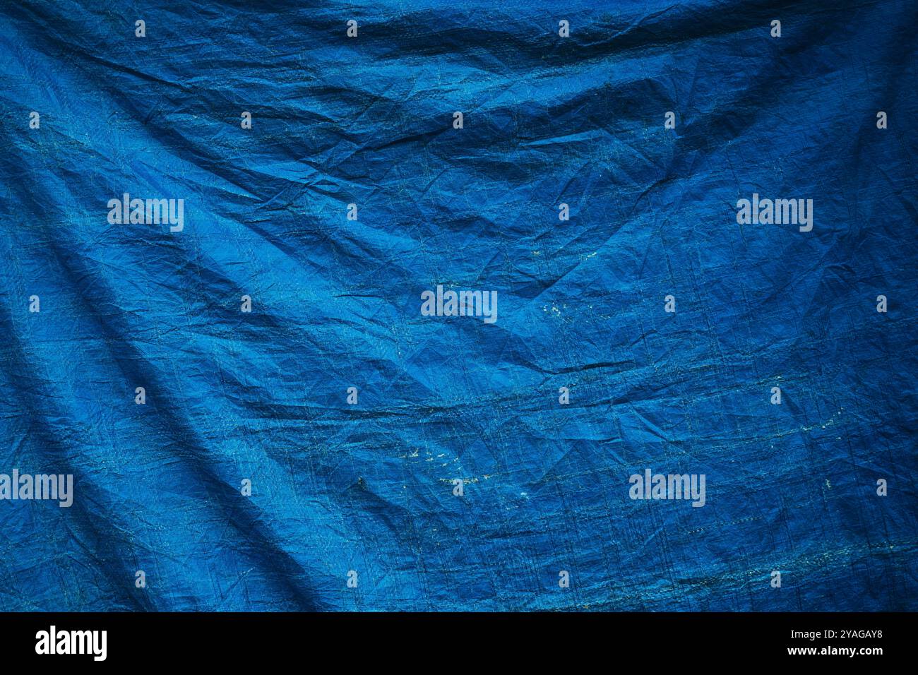 Worn blue tarpaulin material texture as background Stock Photo - Alamy