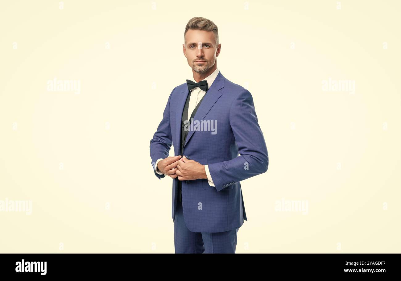 handsome formal man in blue tuxedo bowtie isolated on white background ...