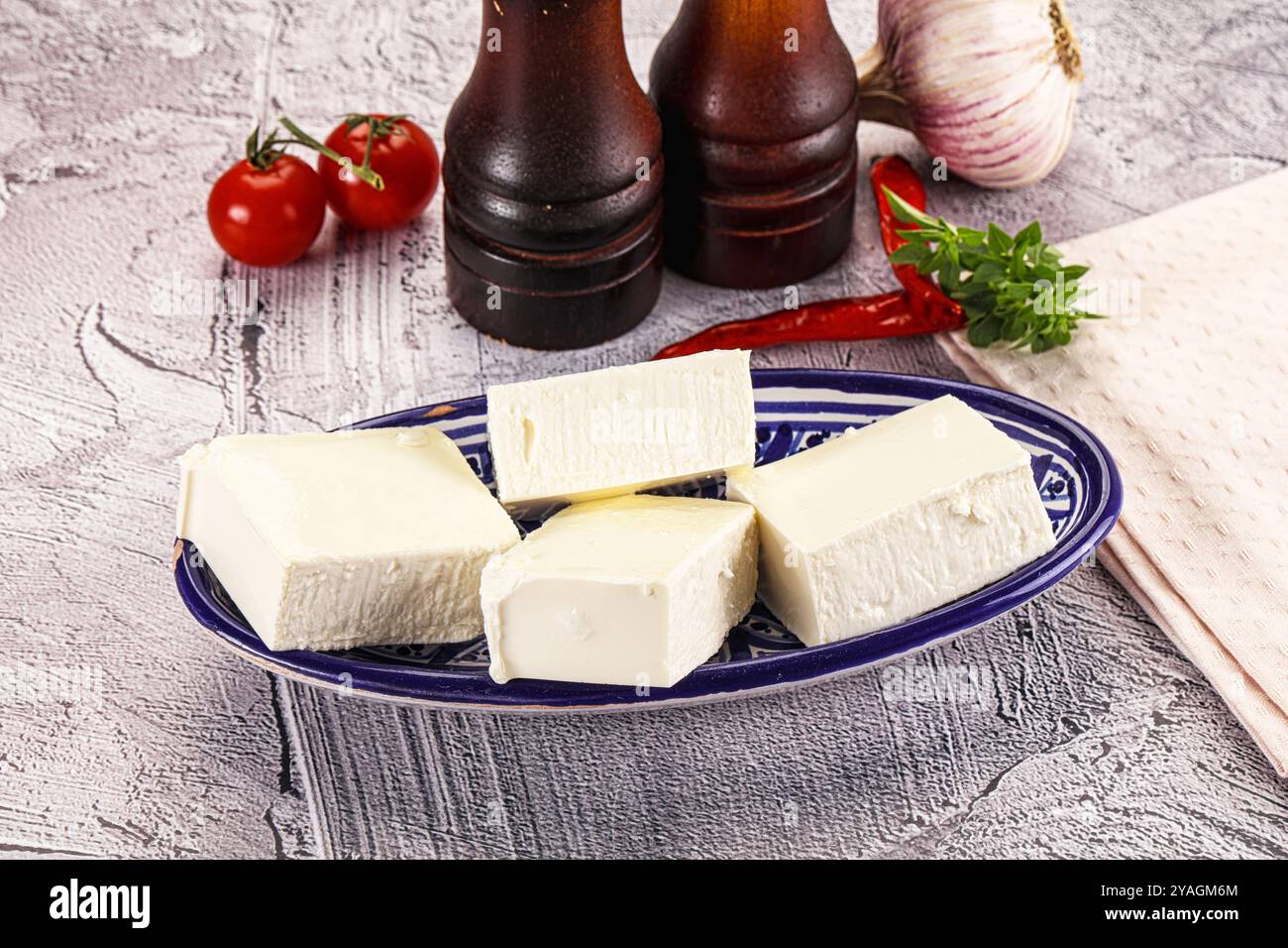 Greek traditional cuisine - Feta cheese bricks Stock Photo - Alamy