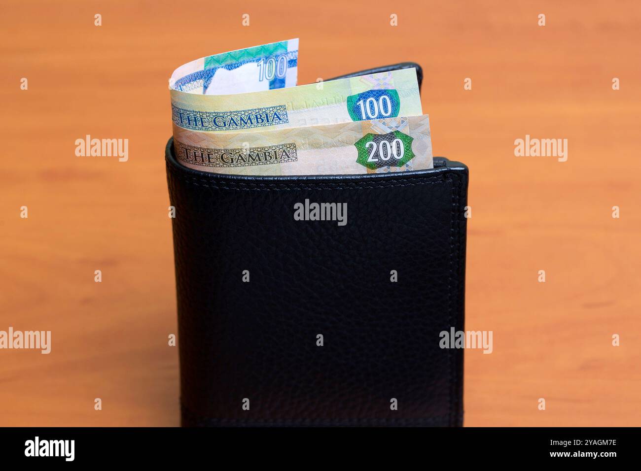 Gambian money - dalasi in the black wallet Stock Photo