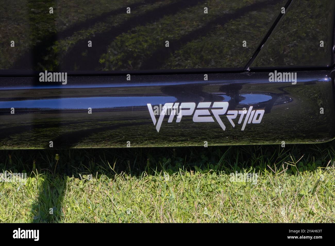Detail of a silver viper rt10 logo on the side of a black dodge viper ...