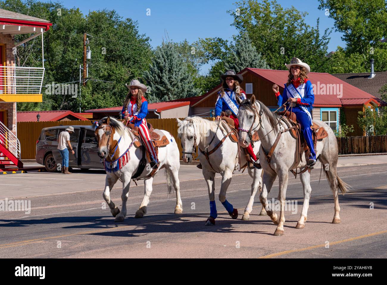 The rodeo queen and her attendents on horseback in the Fourth of July ...