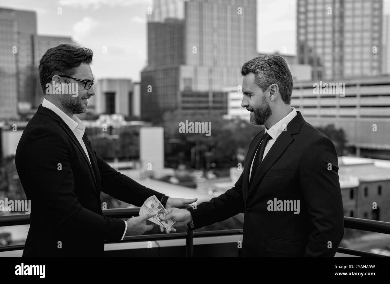 Men discuss money Black and White Stock Photos & Images - Alamy