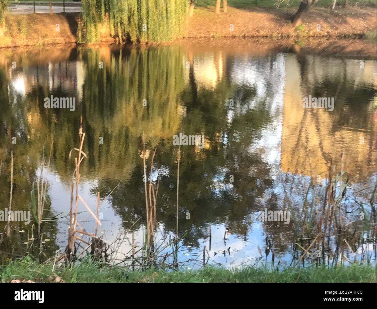 Water surface, reflection, gentle waves, blue background. Stock Photo