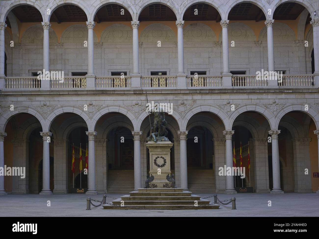 Alcázar of Toledo. Parade Ground, also known as Courtyard of Charles V. It features a square floor plan of portico galleries into two levels, with double arches supported by columns. In the centre of the courtyard there is a 19th century copy of the allegorical sculpture of 'Charles V Dominating Fury', the original of which, made by Leone and Pompeo Leoni, is on display in the Prado National Museum. The building was reconstructed after severe damage suffered during the Civil War (1936-1939). Castile-La Mancha. Spain. Stock Photo