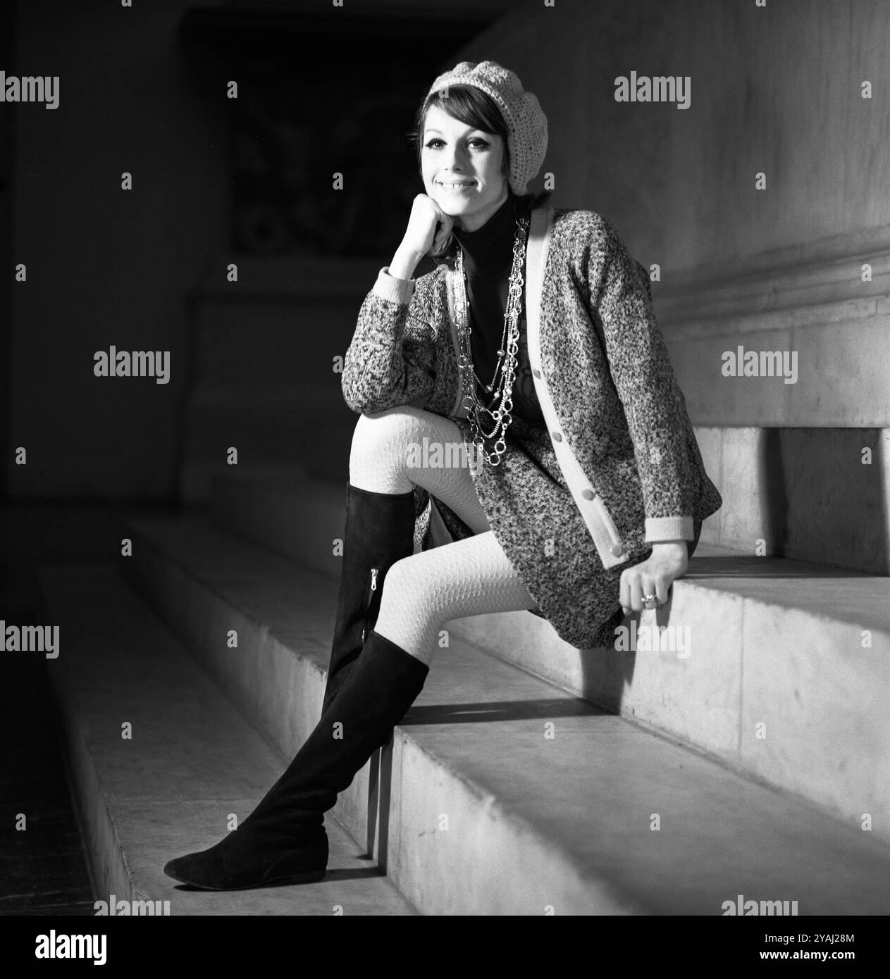 01.07.1971, German Democratic Republic, , Berlin - Advertising shot for fashion magazines: model shows the latest autumn fashion. 00S710701D066CAROEX. Stock Photo