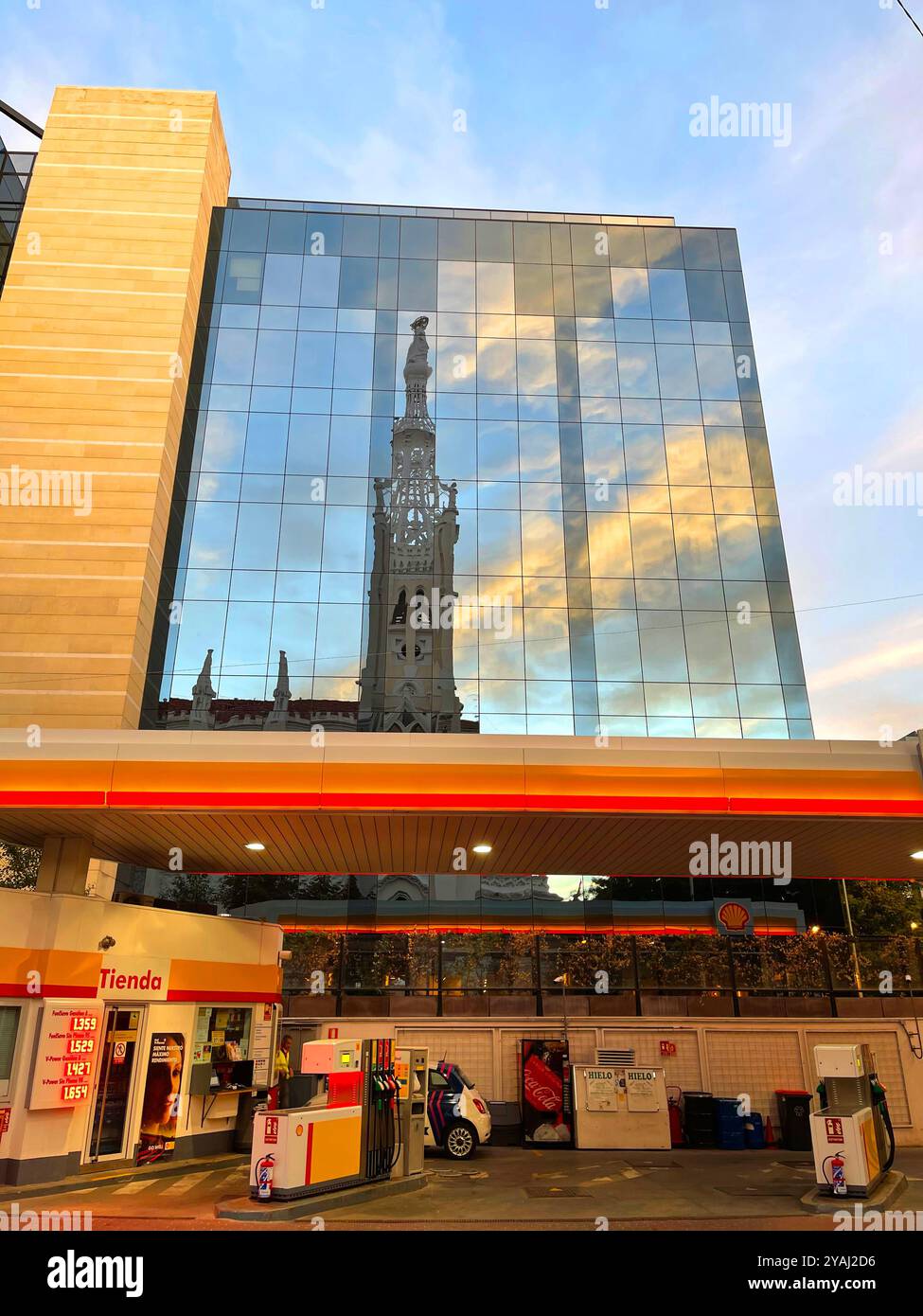 Petrol station and reflection on glass facade. Goya street, Madrid, Spain. - Smartphone Captured Stock Image