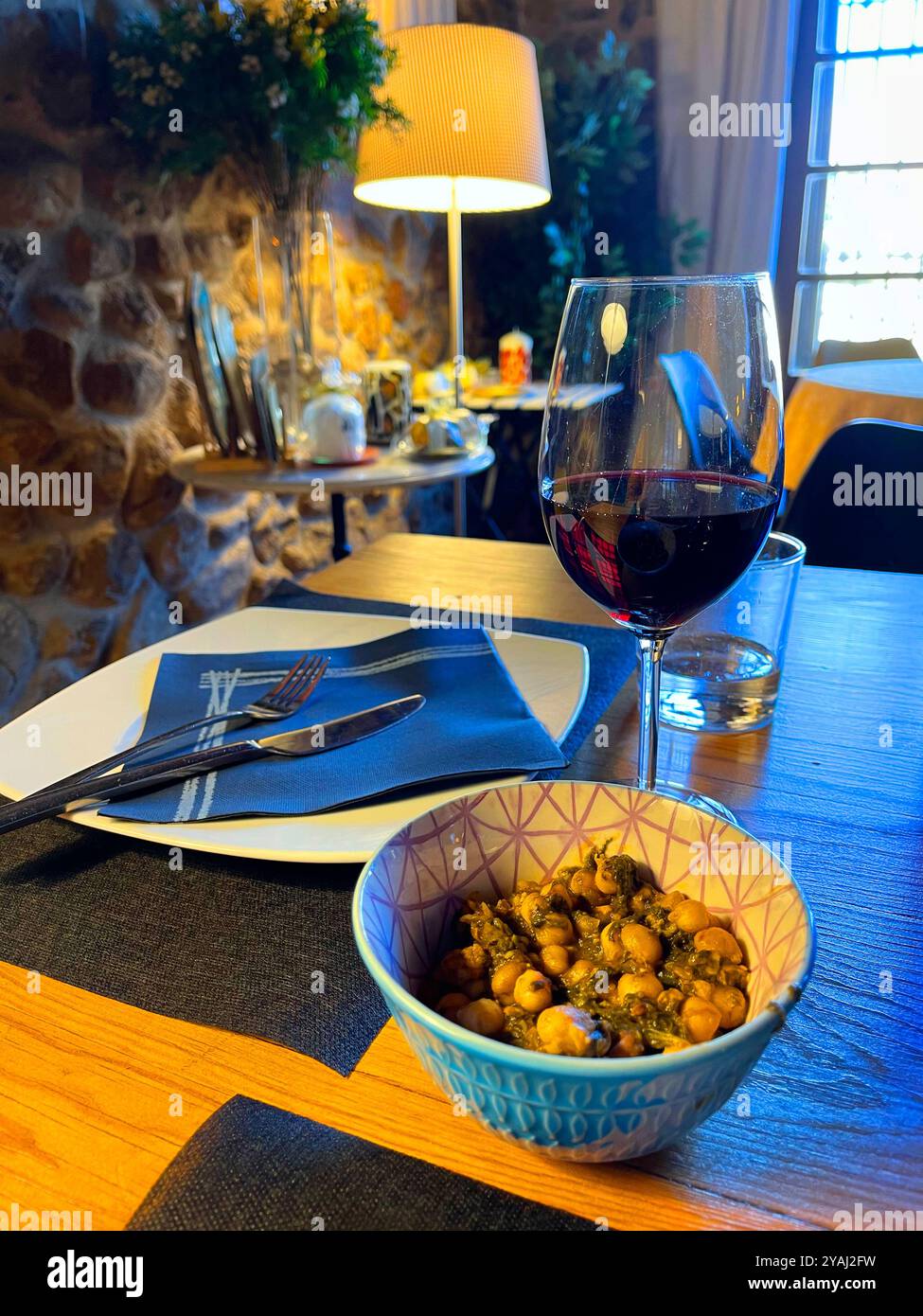 Glass of red wine with tapa. Spain. - Smartphone Captured Stock Image