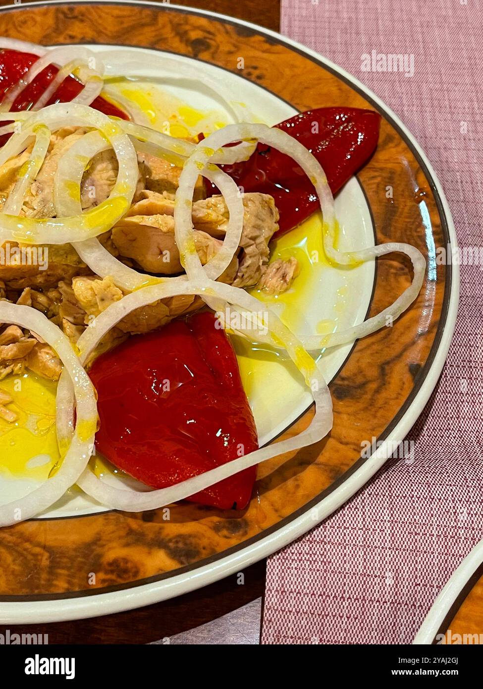 Salad made of tuna loin, onion, Piquillo peppers and olive oil. Spain. - Smartphone Captured Stock Image