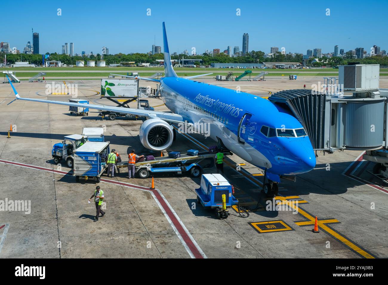 06.03.2024, Argentina, Buenos Aires, Buenos Aires - A Boeing 737 MAX aircraft of the airline Aerolineas Argentinas is loaded with suitcases at the air Stock Photo