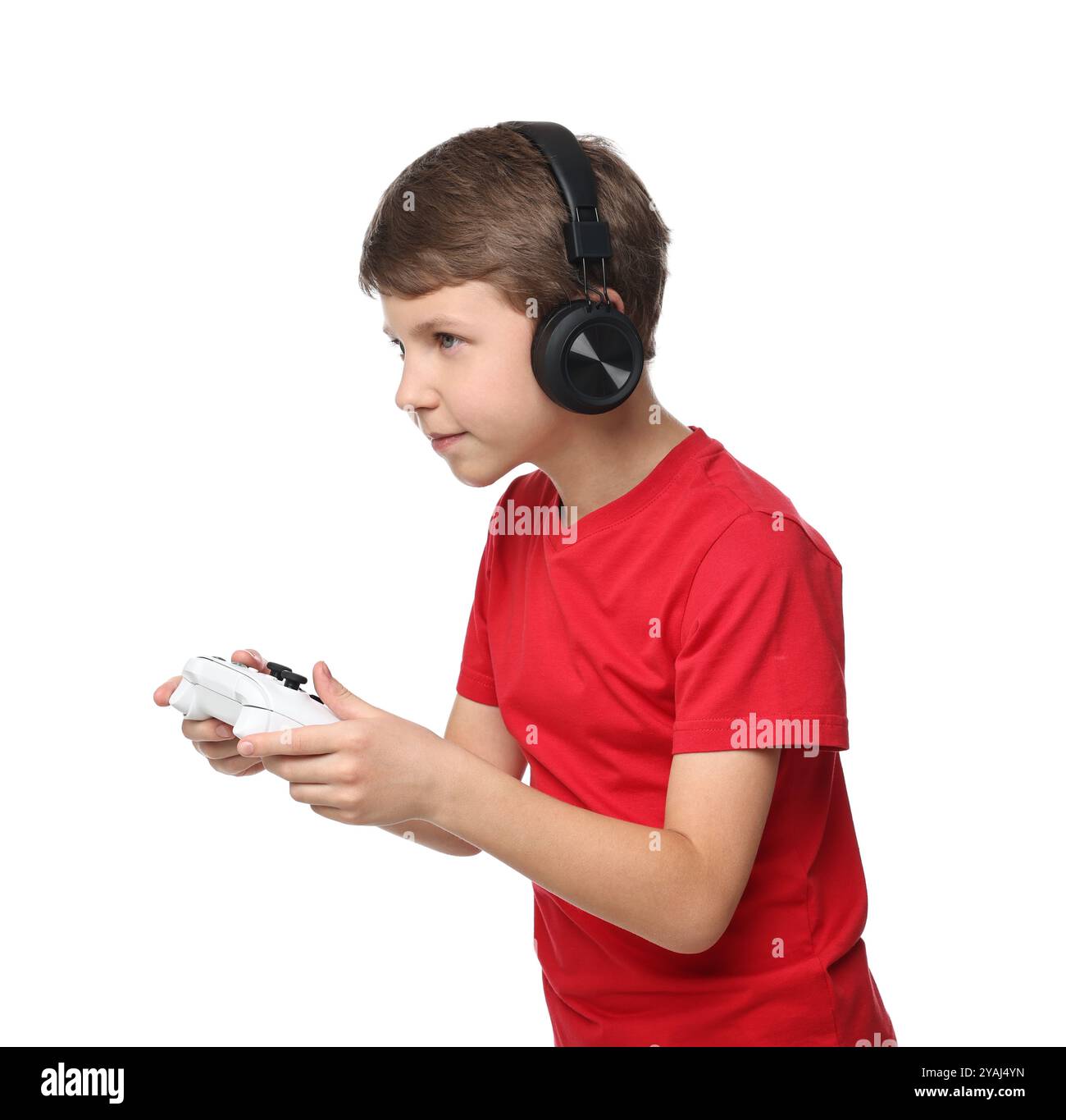 Cute little boy in headphones playing video game with controller on ...