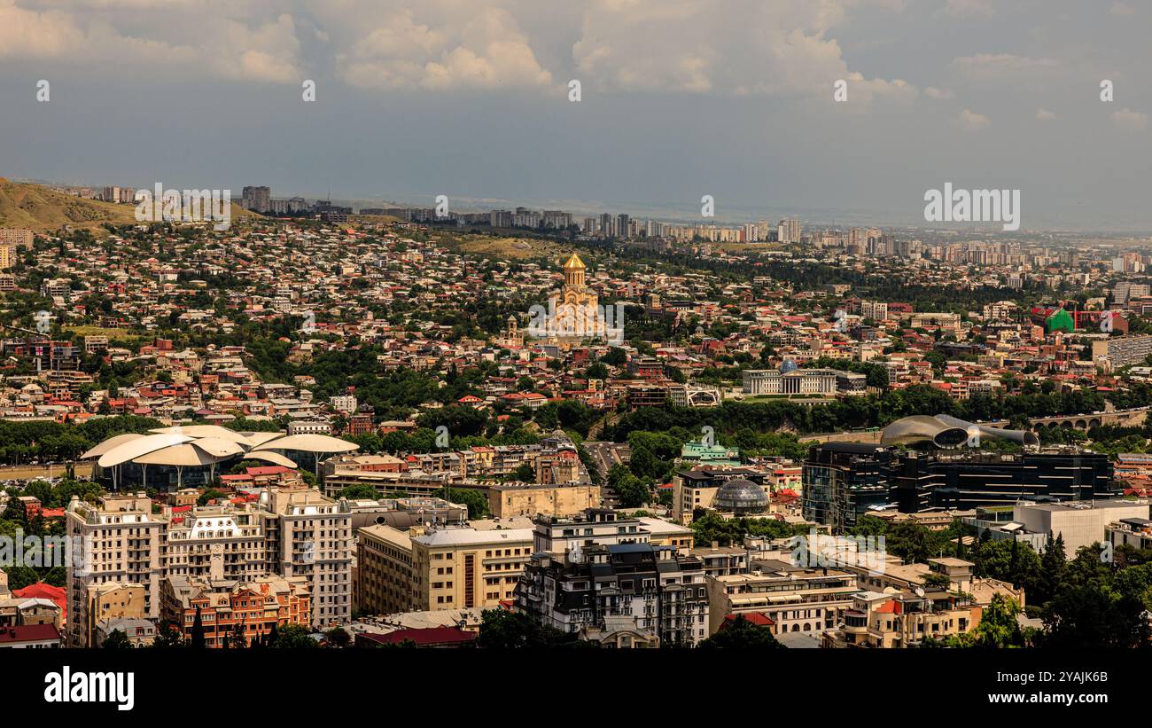 wide view of the city of tbilisi from mtatsminda park with the imposing golden cathedral of holy trinity at the centre Stock Photo