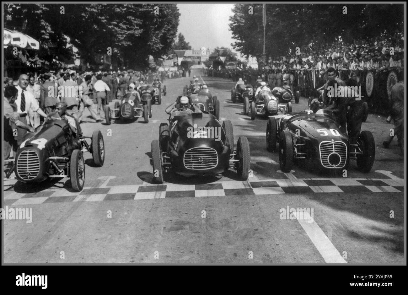 Circuito di Mantova on 13 June 1948.  In the centre is entry #2, the 1948 Ferrari 166 SC s/n 018i driven by Tazio Nuvolari (did not finish, he was ill).[1] On his right is entry #50, a Maserati A6GCS, the driver could be one of Alberto Ascari or Luigi Villoresi.[2]  On the left is entry #14, looks like a Cisitalia D46/47, there were many of these in this race.  In third row, left it seems entry #26 would be the 1948 Ferrari 166 SC s/n 010i driven by Bruno Sterzi,[3] and at right it seems entry #16 is the 1948 Ferrari 166 SC/500 TR s/n 014i driven by Giampiero Bianchetti.[4] Stock Photo