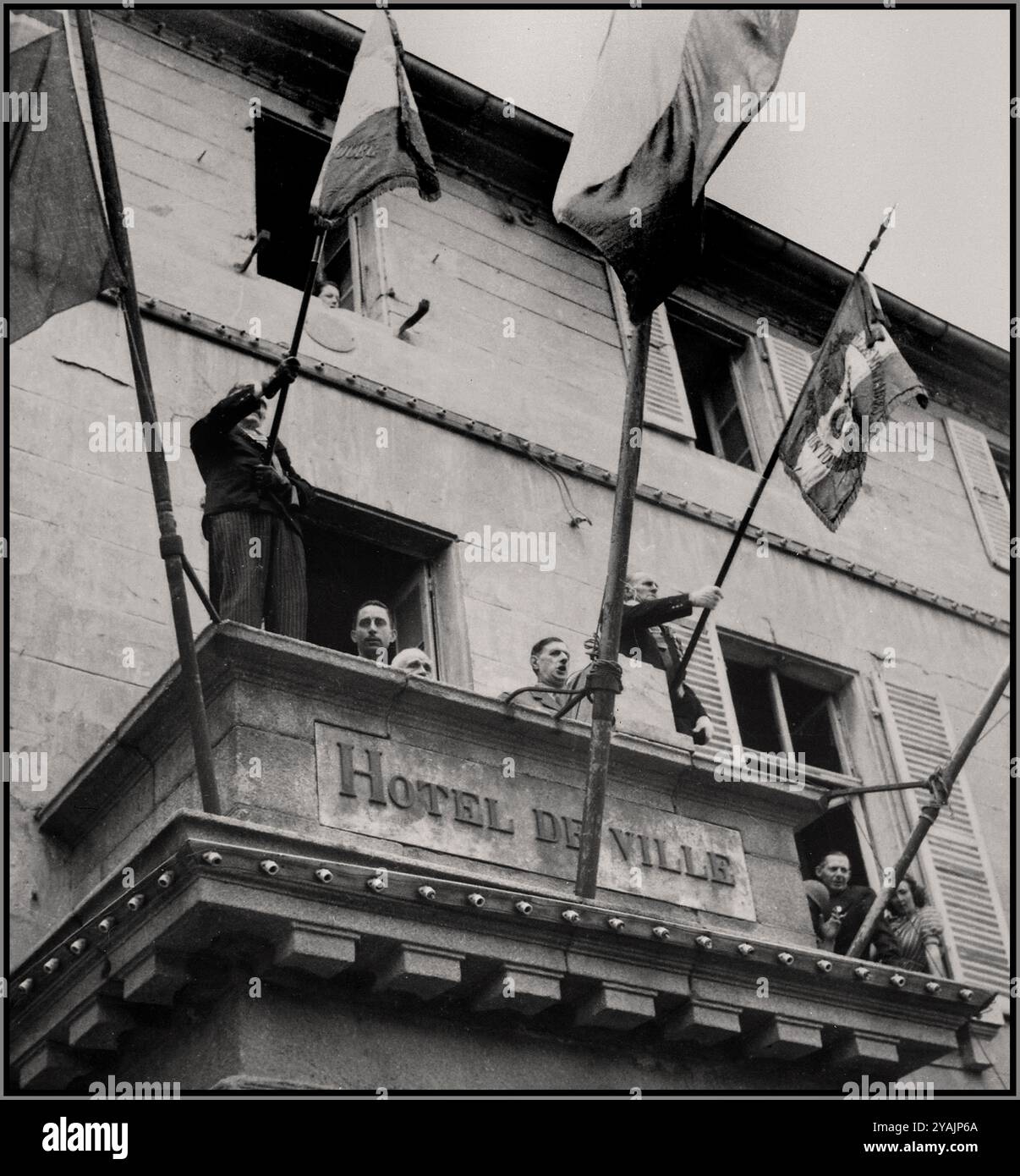 France Liberation WW2 General Charles de Gaulle, President of the French Committee of National Liberation, speaks to the people of Cherbourg from the balcony of City Hall during his visit to French port city on August 20, 1944. De Gaulle's visit to Cherbourg was part of his broader effort to restore French sovereignty and reassert the authority of the Free French government following years of Nazi occupation. Addressing the people of Cherbourg, de Gaulle expressed gratitude for the liberation and emphasized the importance of rebuilding France as a unified and independent nation. Stock Photo