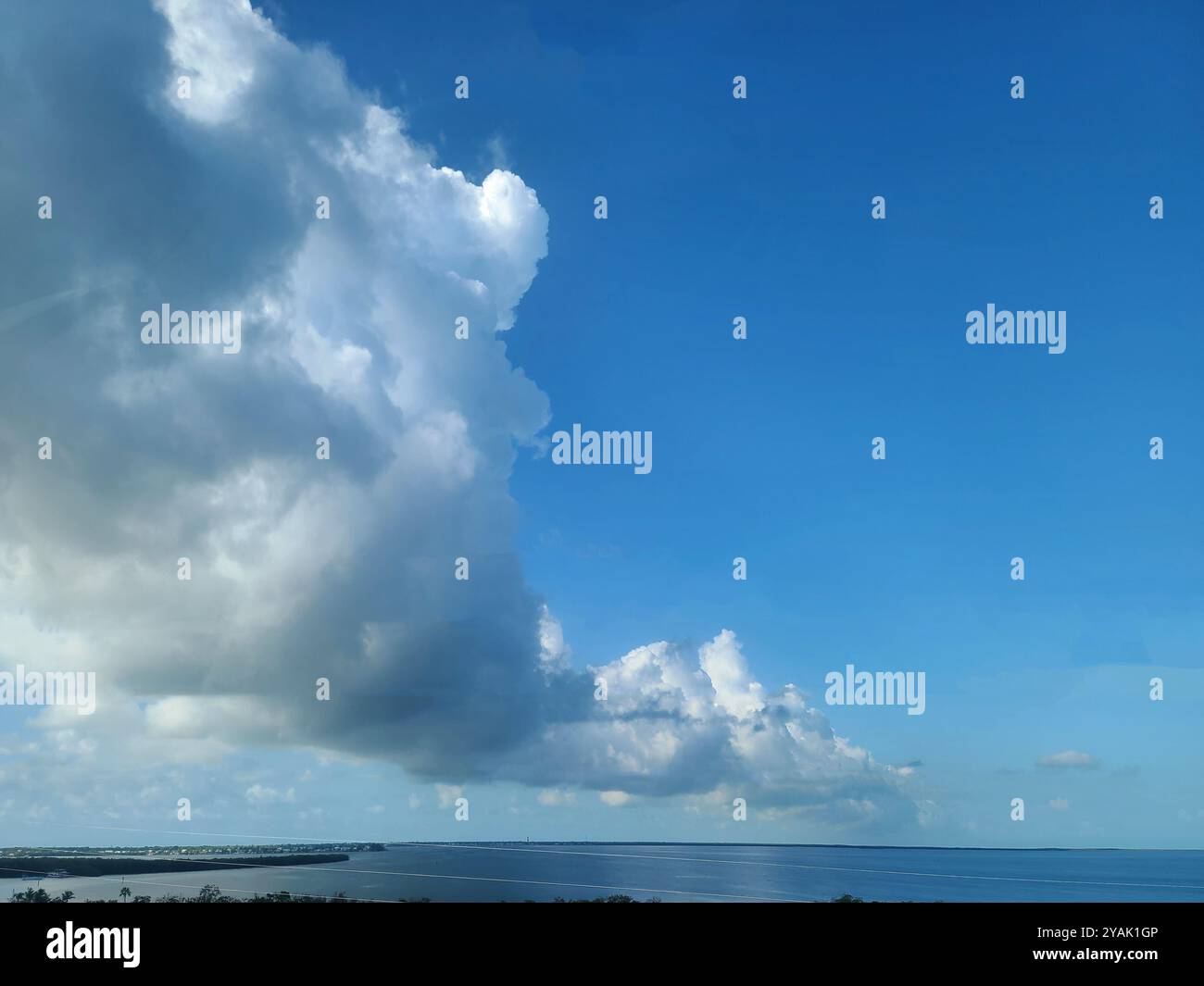 Blue ocean clouds in clear hi-res stock photography and images - Alamy