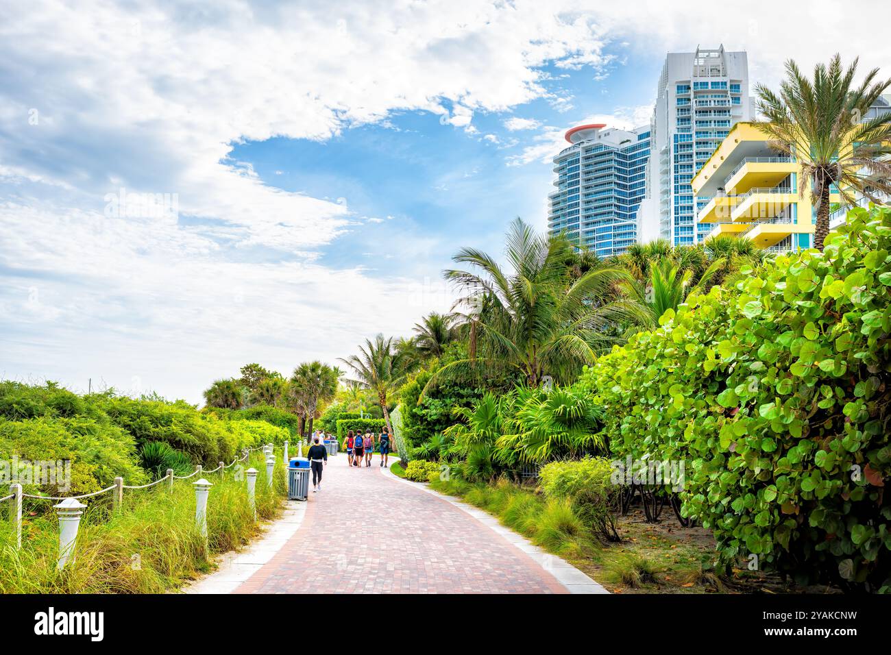 South Beach, USA - January 17, 2021: Lummus park in Miami beach, Florida with people walking on boardwalk bike path at art deco district Stock Photo