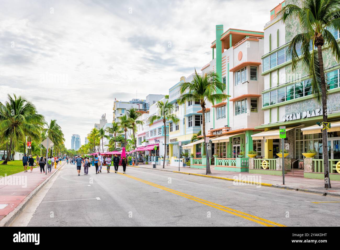 South Beach, USA - January 17, 2021: Art deco district street hotels, people walking on Ocean drive by colorful retro architecture in Miami, Florida Stock Photo