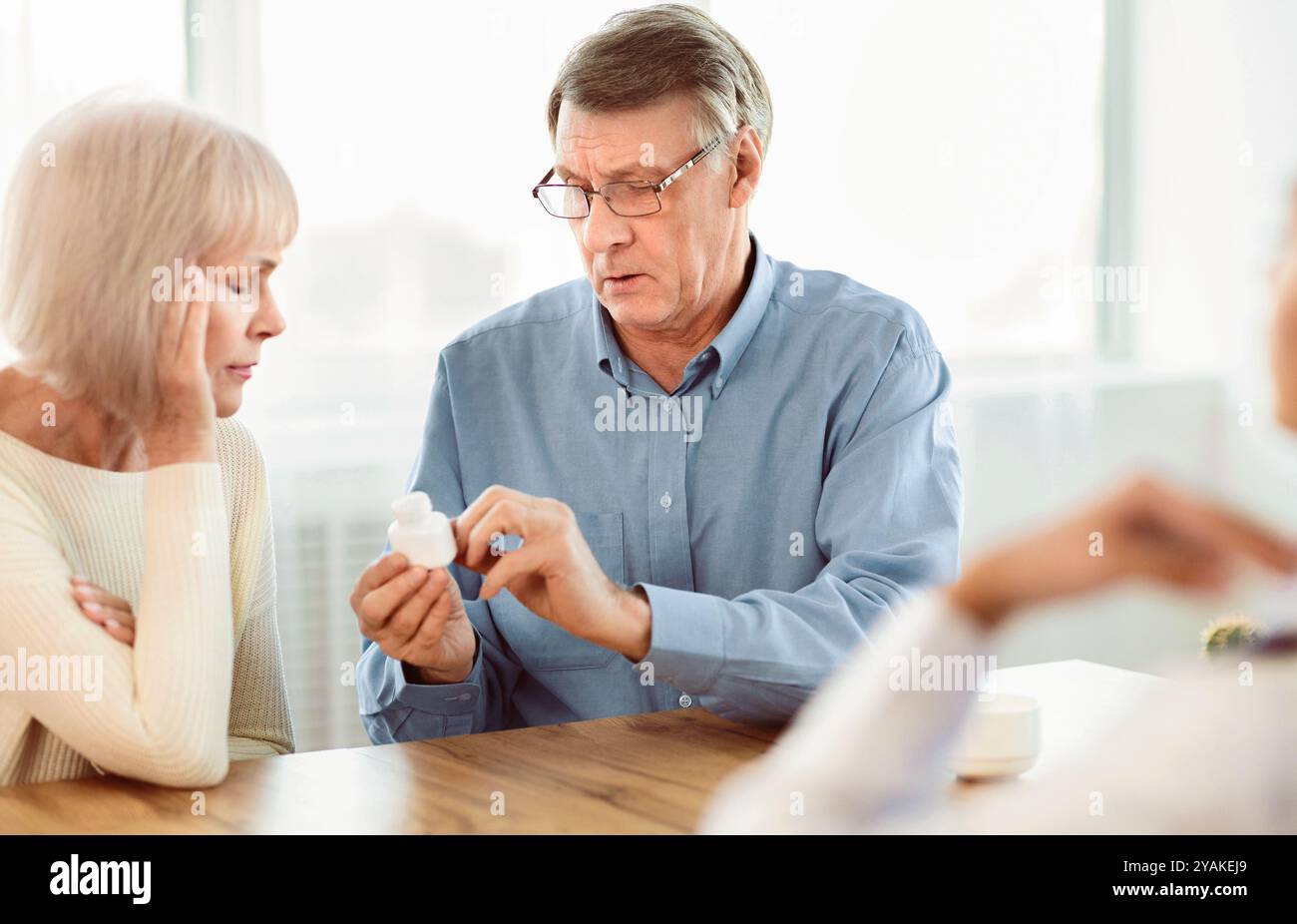 Mature couple asking doctor hi-res stock photography and images - Alamy