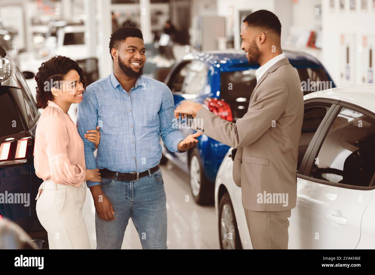 Happy young afro salesman hi-res stock photography and images - Alamy