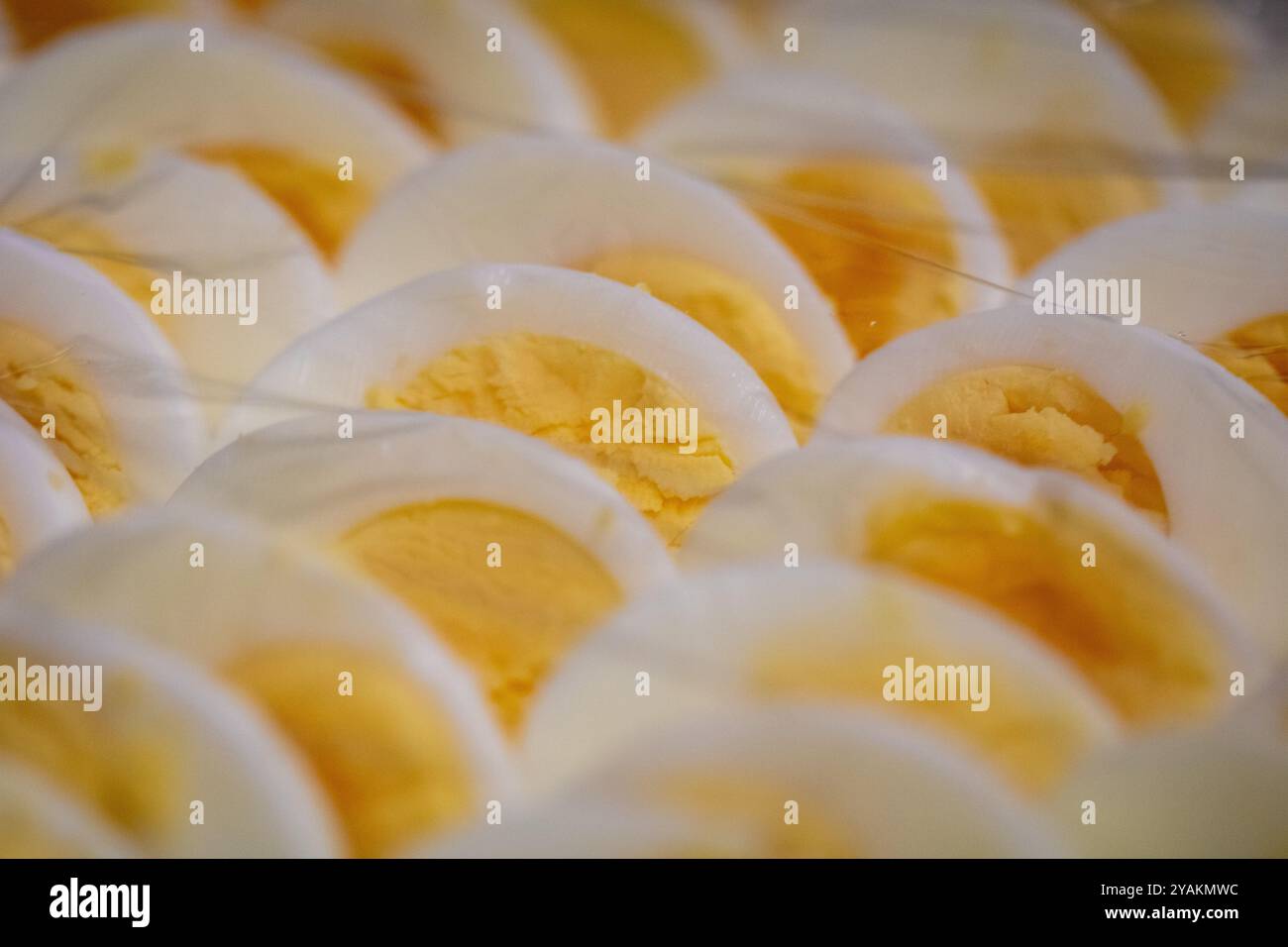 Sliced Eggs as a condiment under plastic wrap Stock Photo