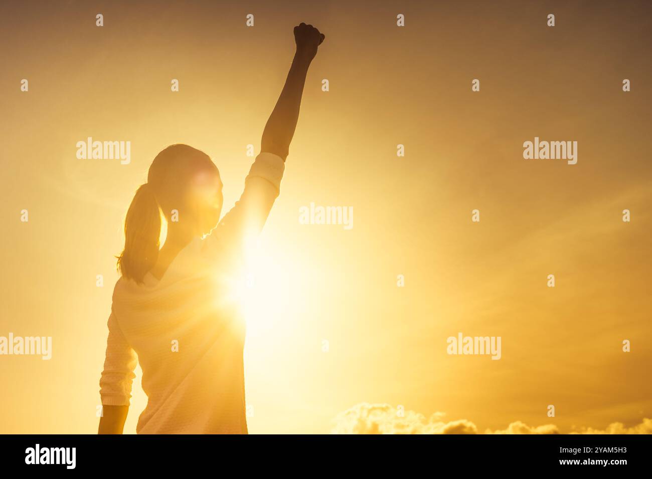 Woman fist in air hi-res stock photography and images - Alamy