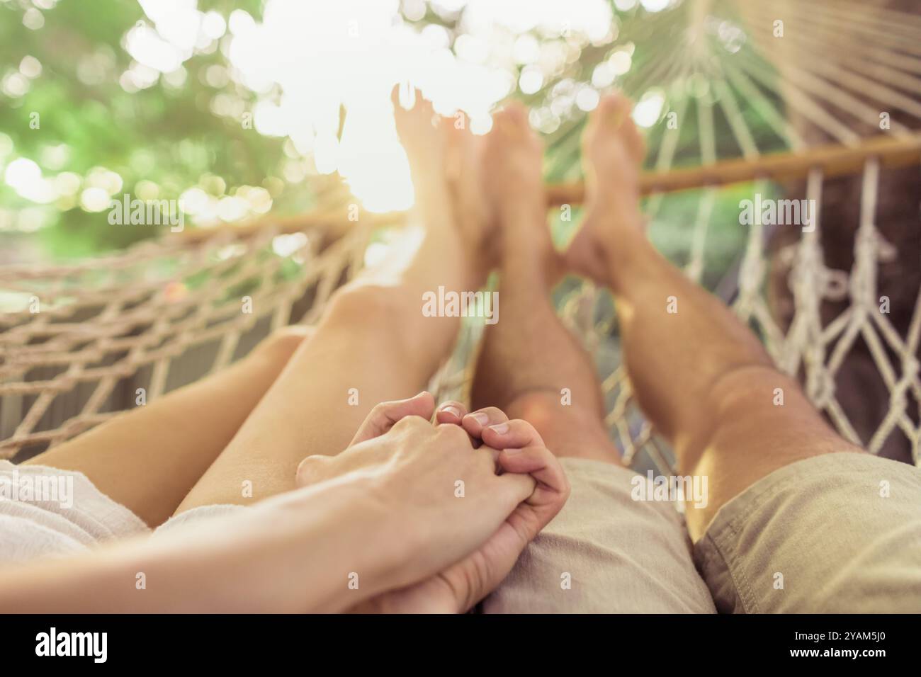 Couple relaxing in the hammock. Stock Photo