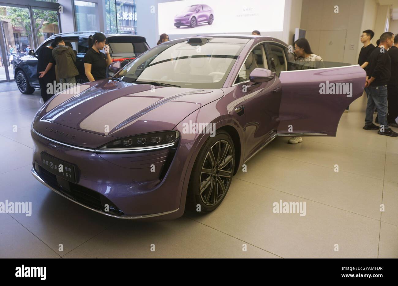 HANGZHOU, CHINA - OCTOBER 15, 2024 - A customer watches a Huawei HIMA ...
