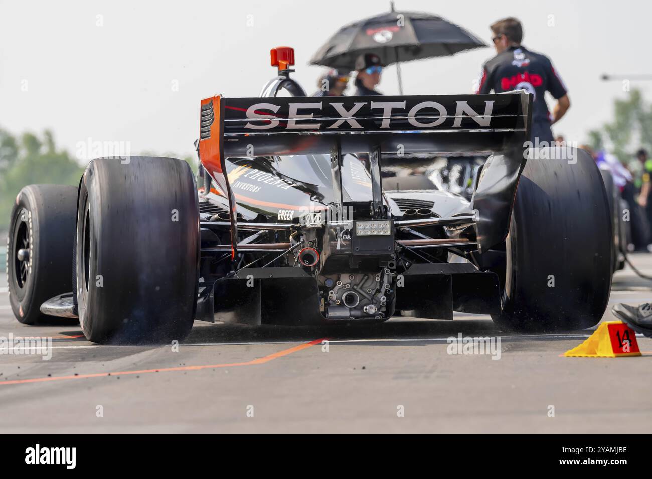 Crew members of AJFoyt Racing prepare their race car for the Sonsio ...