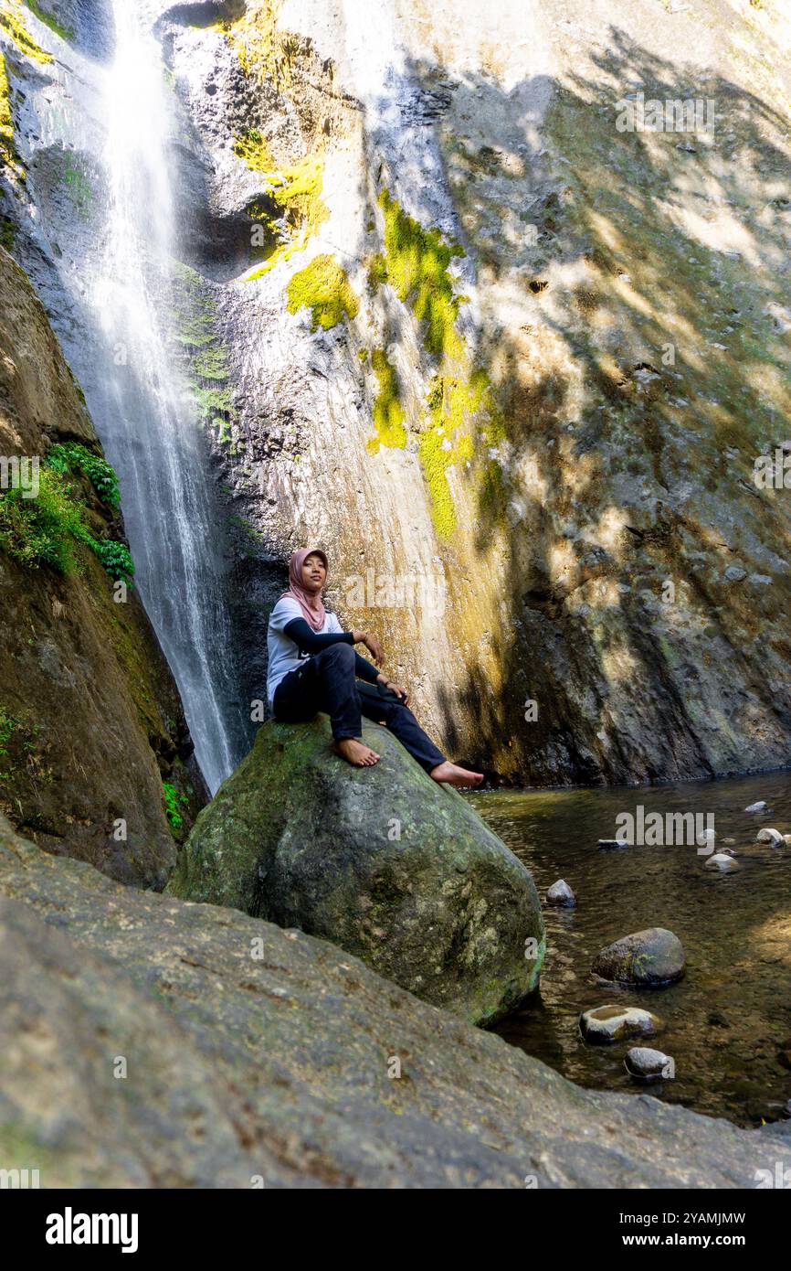 People vacation at dolo waterfall. Dolo is one of the waterfalls in ...