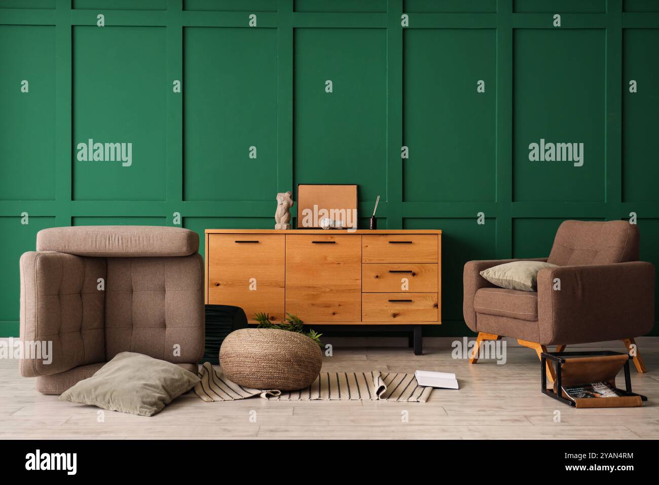 Interior of messy living room with overturned brown armchair, wooden ...
