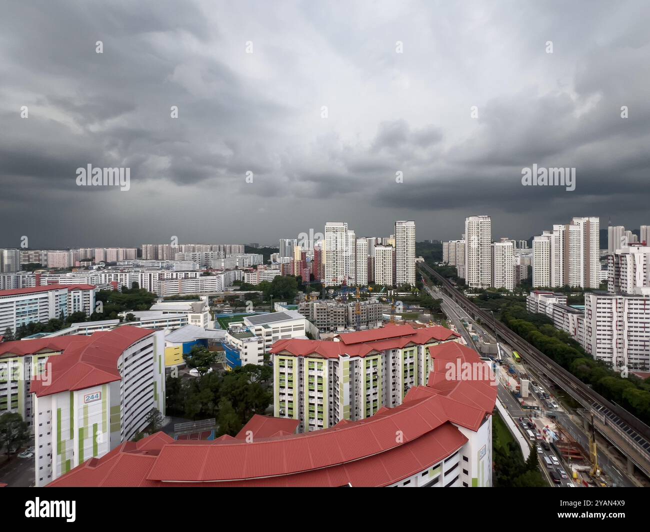 Aerial view of grey clouds hover the sky. Inter-monsoon conditions. Short-duration thundery showers are expected. Singapore. - Smartphone Captured Stock Image